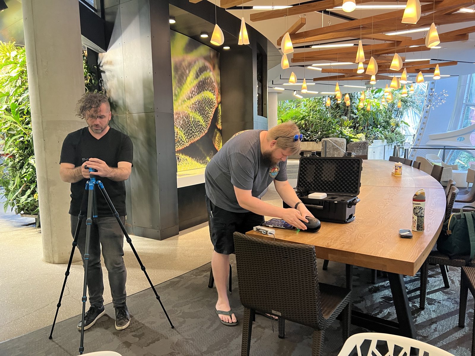 Leica BLK LIDAR scanner mounted on tripod, mid-capture inside the Amazon Spheres