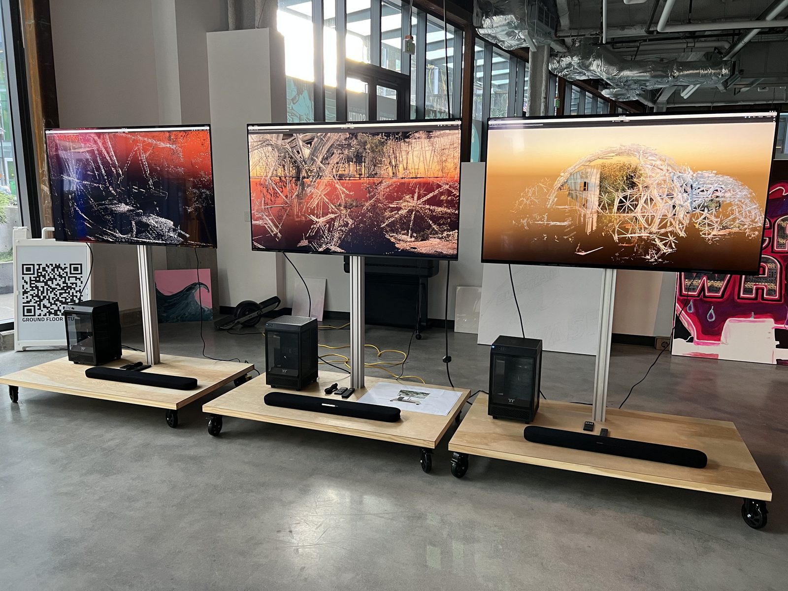 The three completed exhibit stations lined up in the studio, each PC driving an NVIDIA RTX 3090 to render its own point-cloud frame of the Spheres in real time