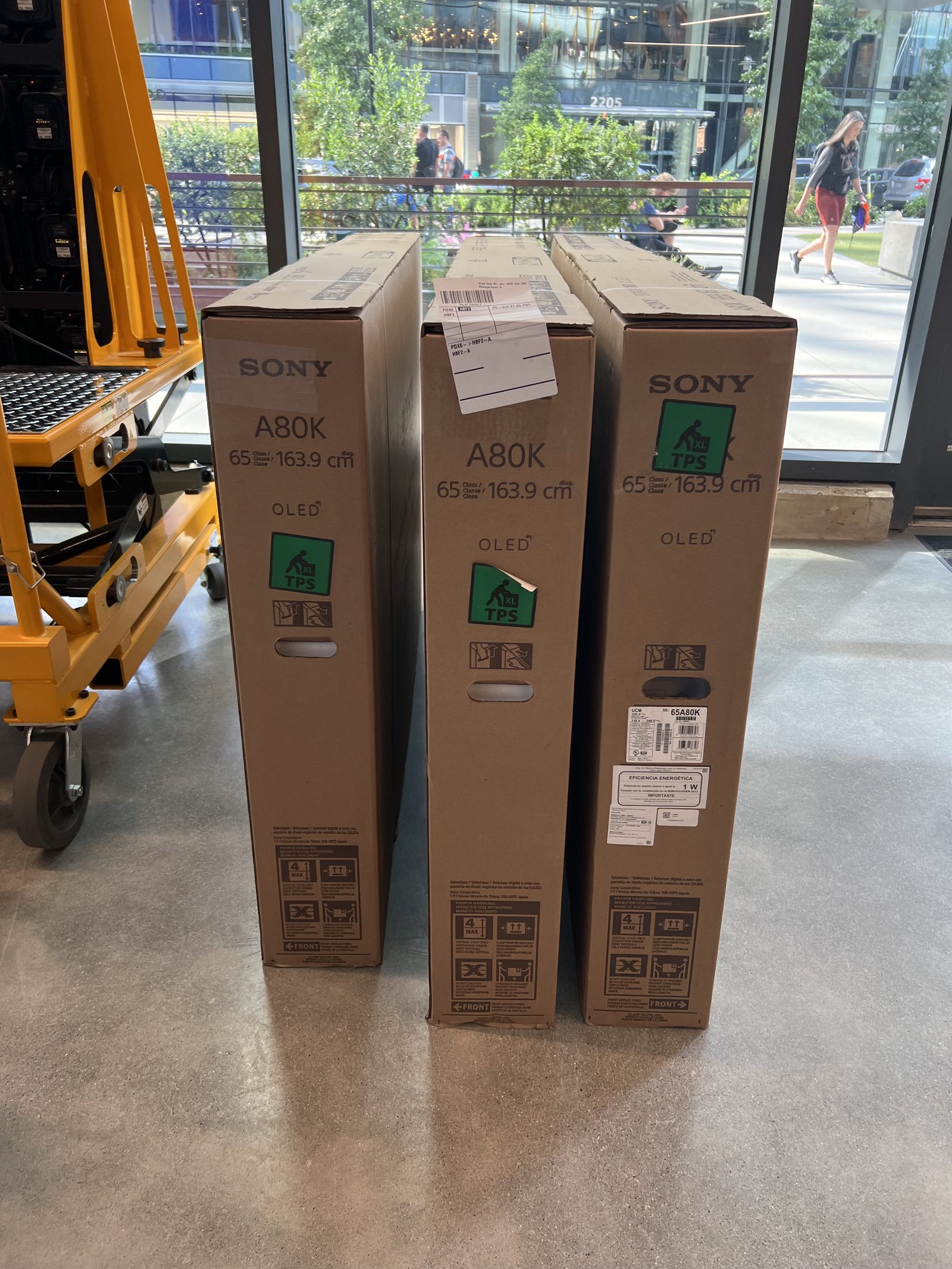 Three boxed Sony A80K 65-inch OLED displays delivered to the studio